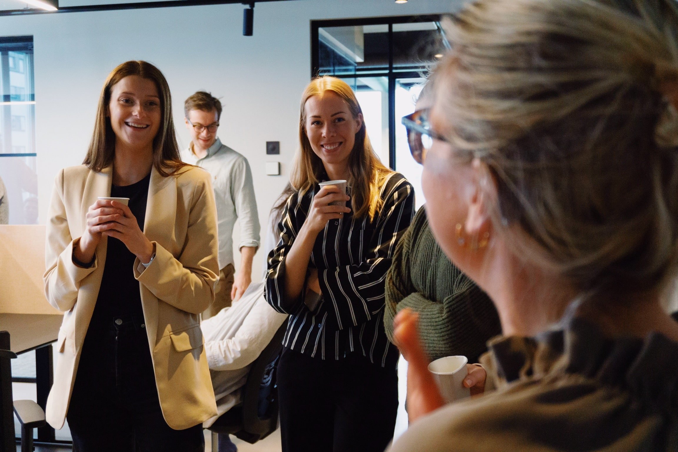 Amby employees drinking coffee