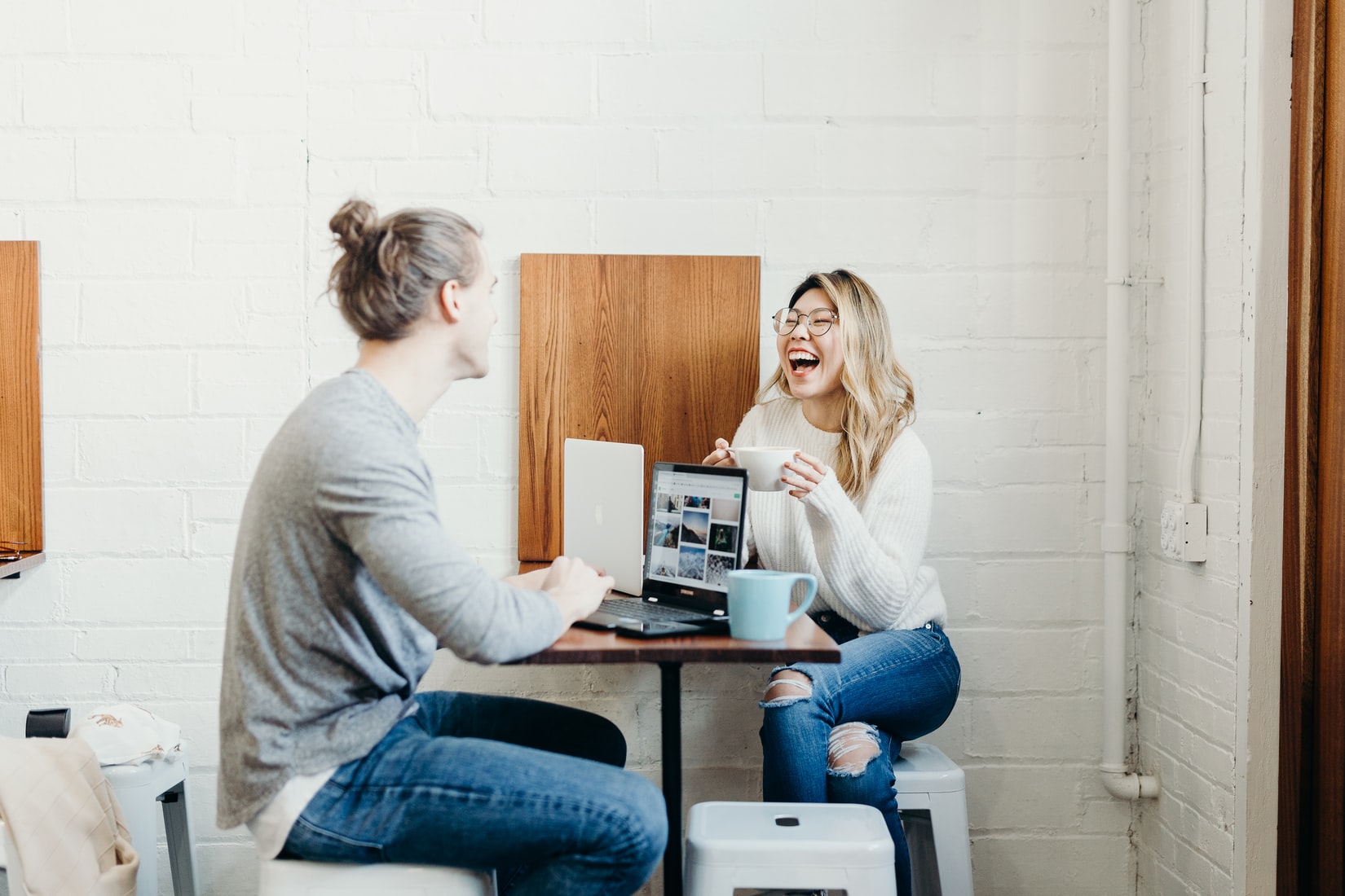 A man and a woman having a meeting in a shop