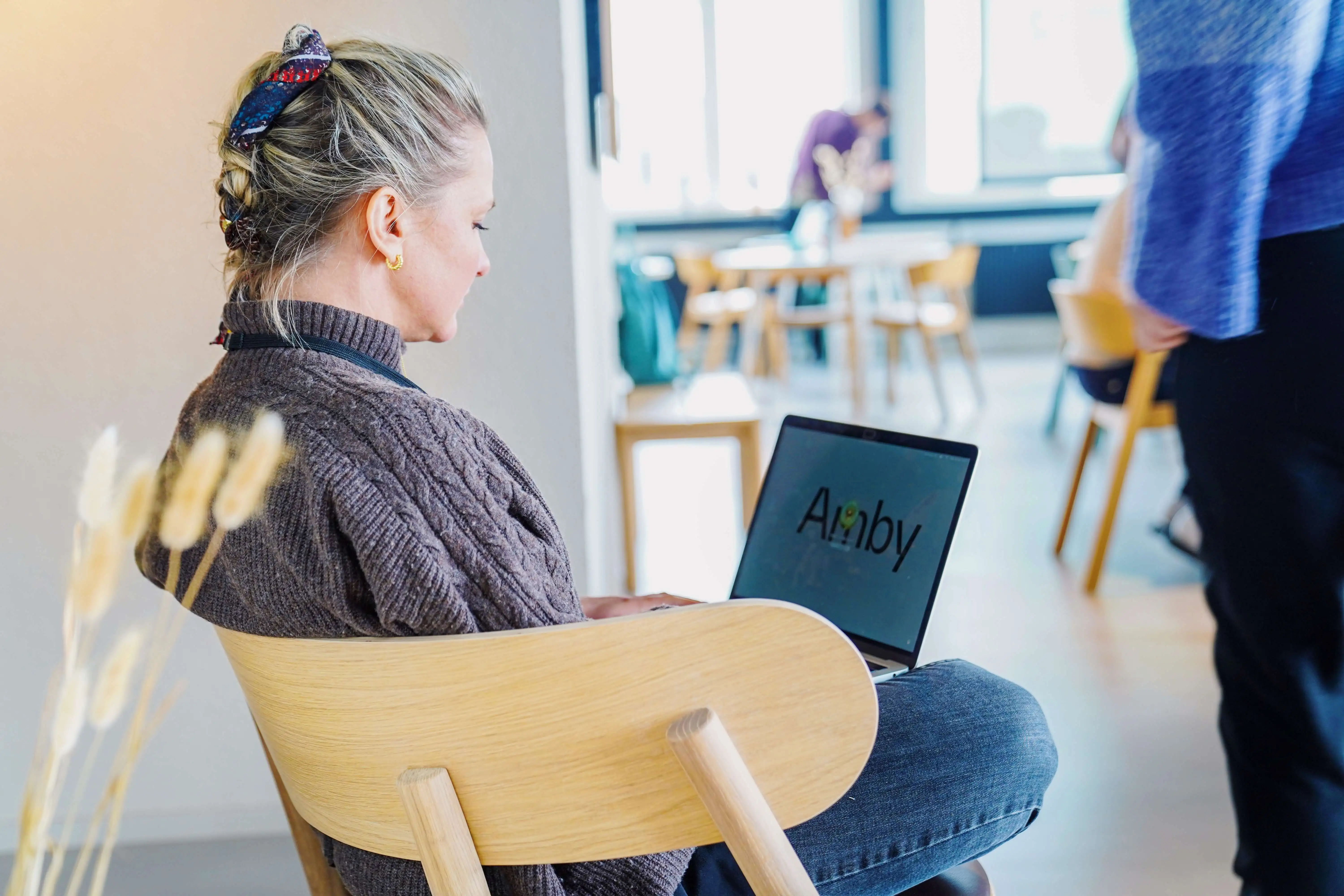 woman sitting in chair and working