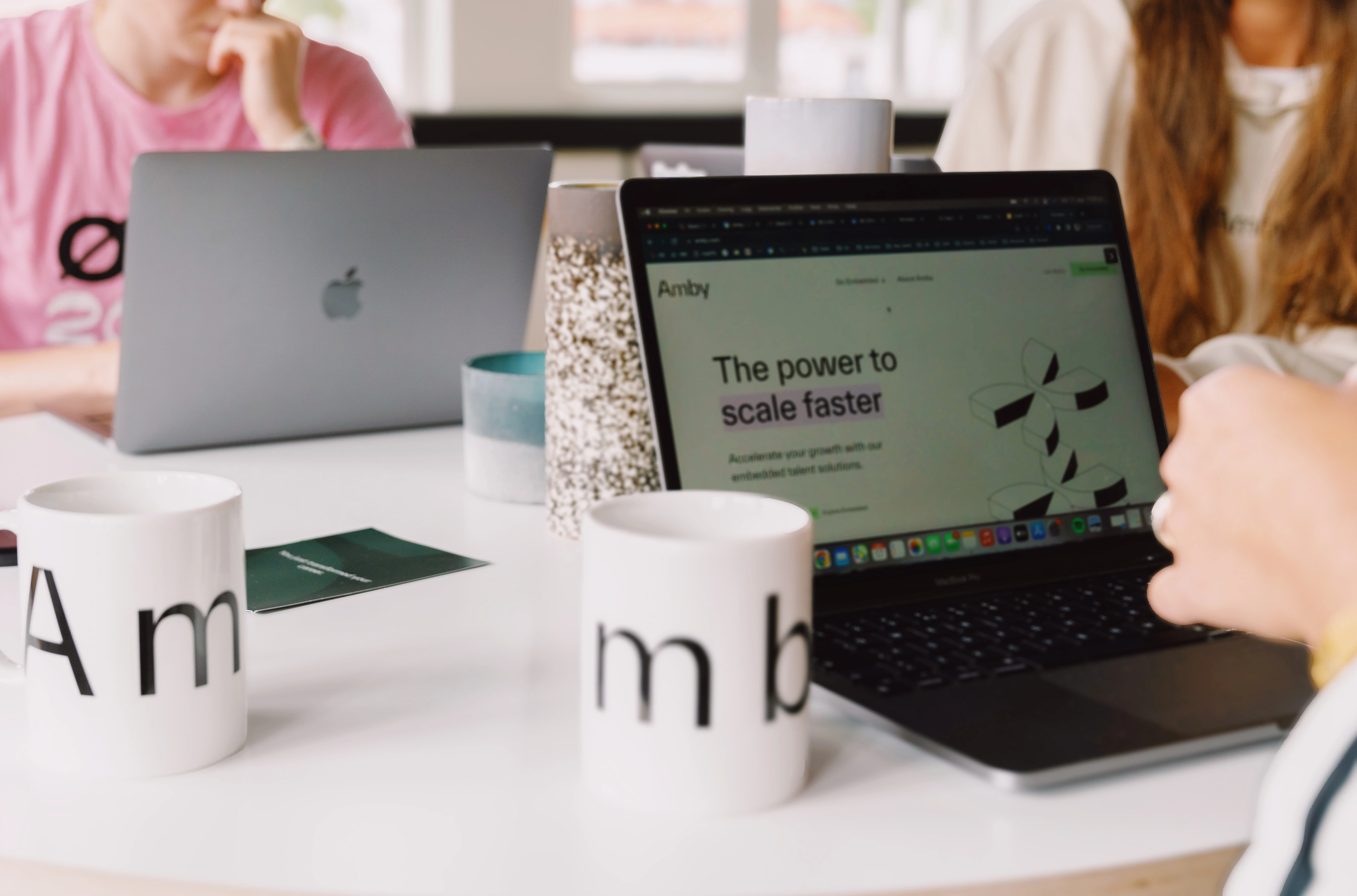 Amby laptops and mugs