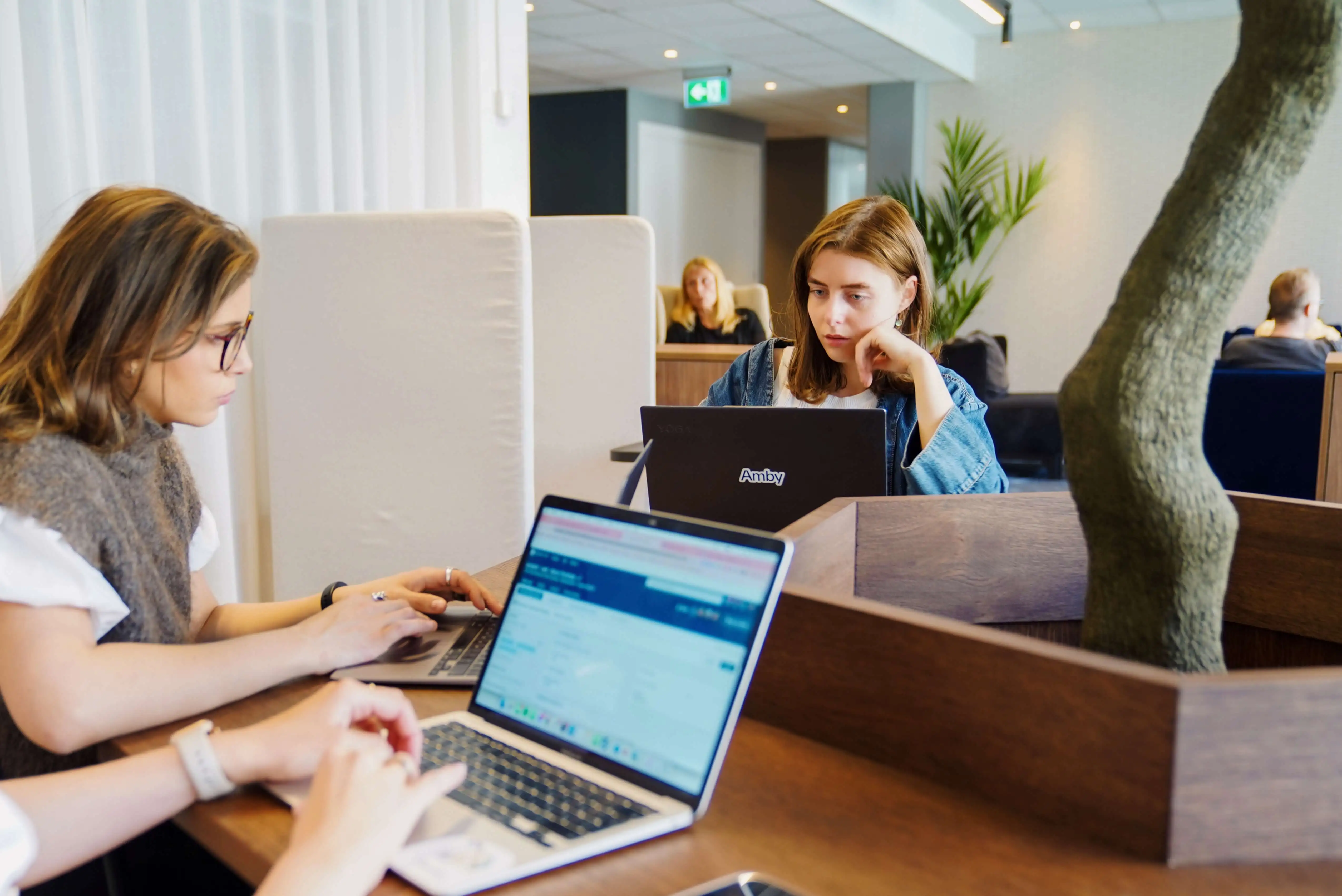 Three people at a desk