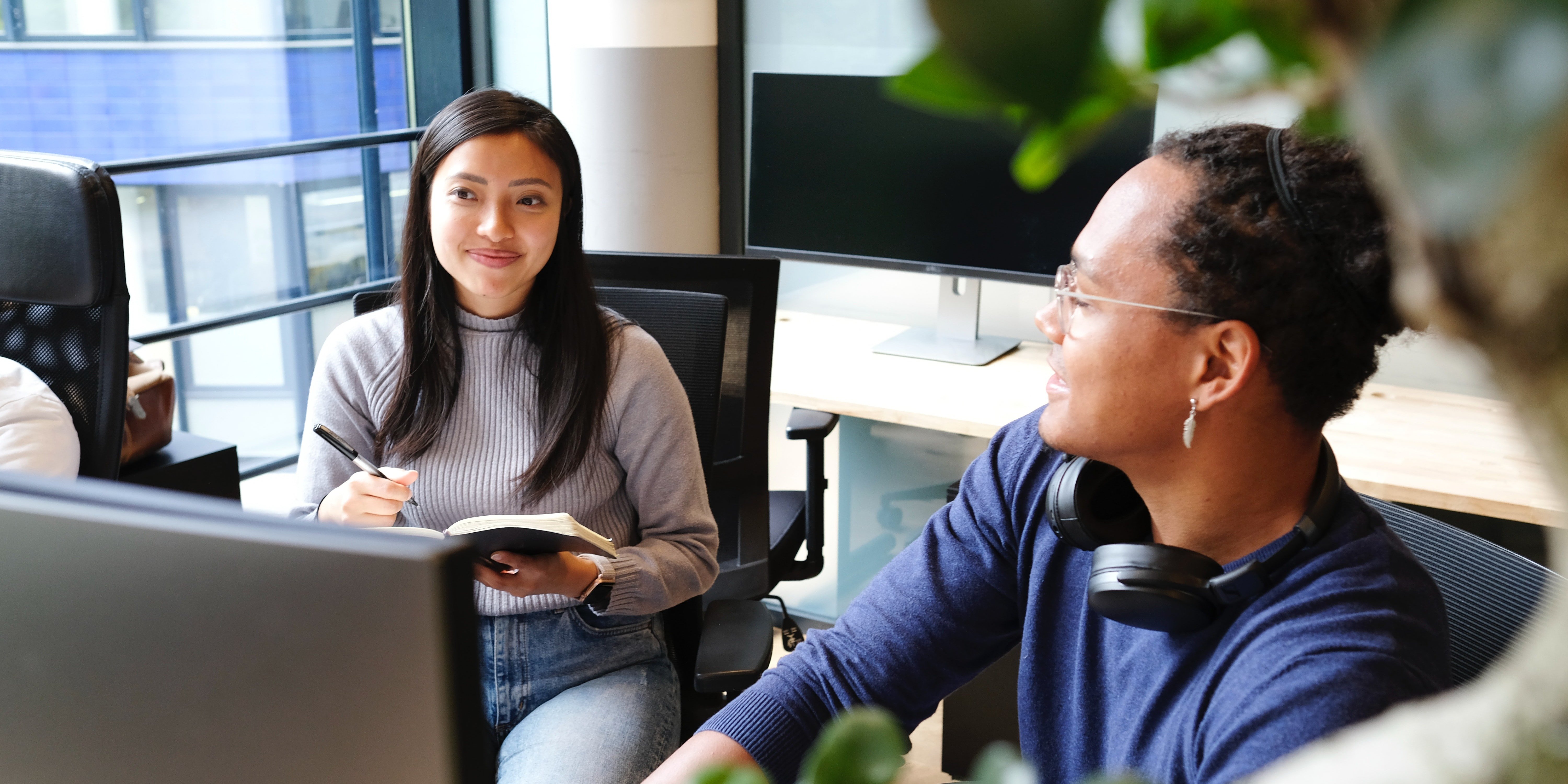 Two employees at a desk