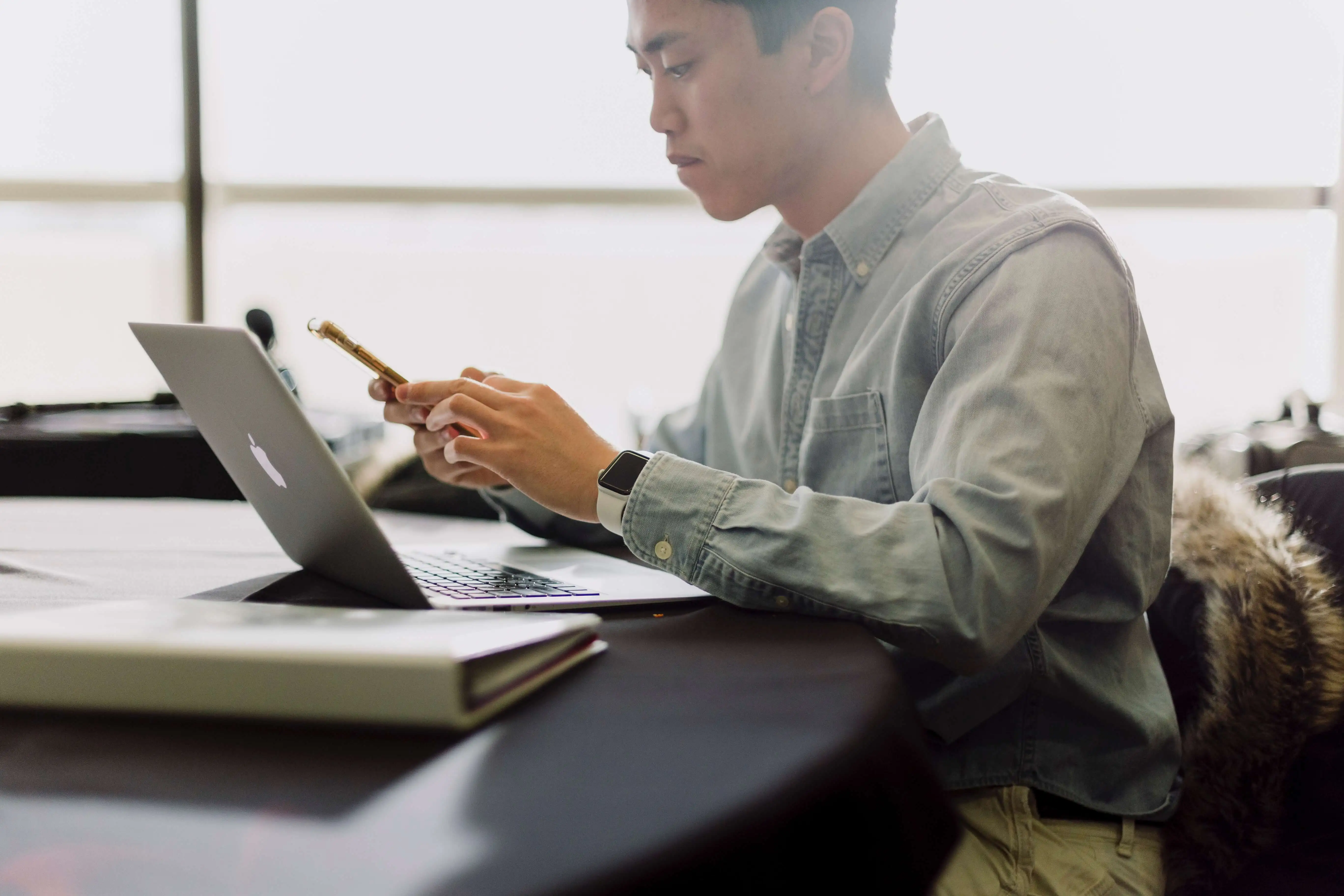 Man at his desk on his phone