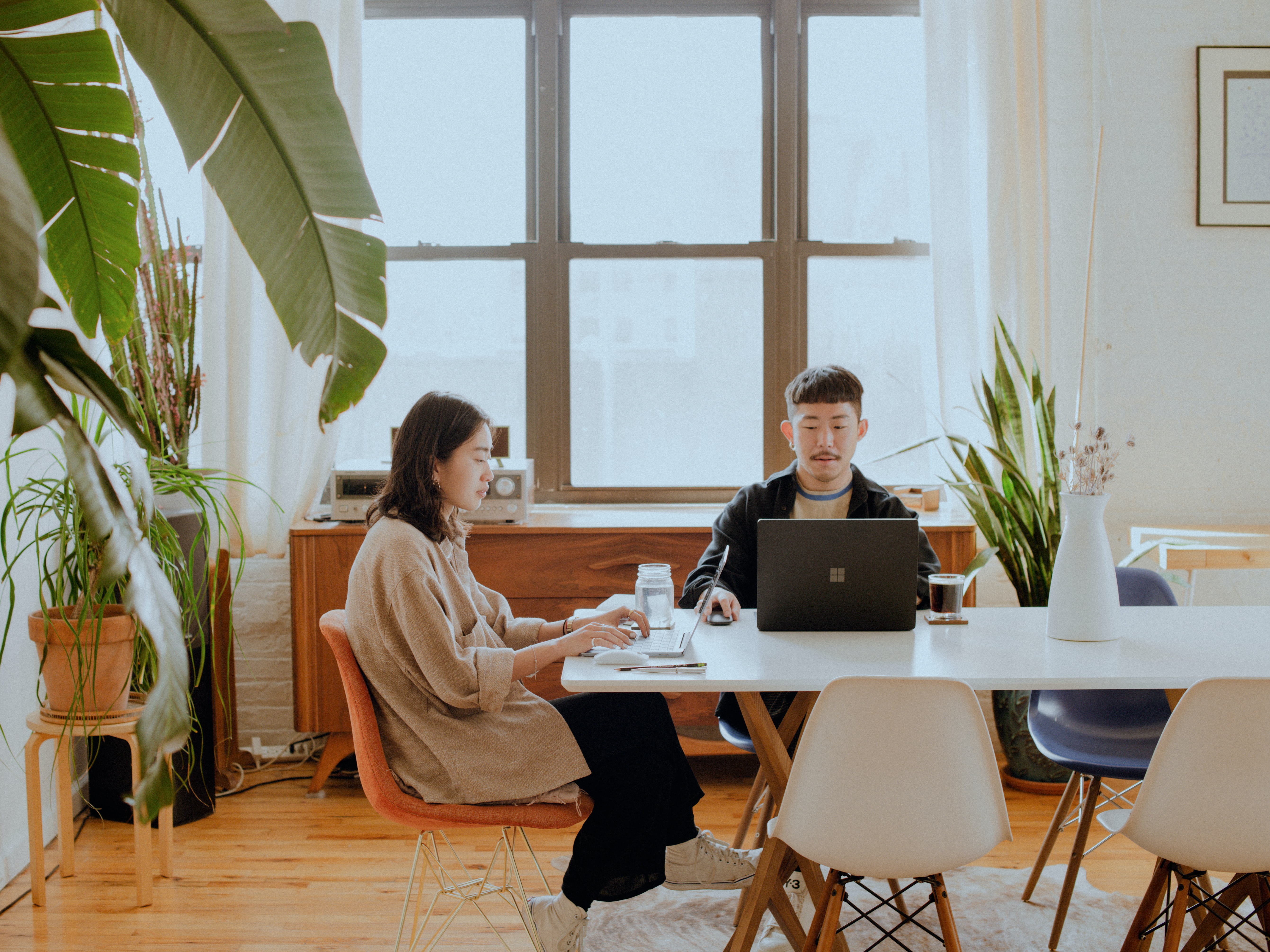 Two employees working at a desk